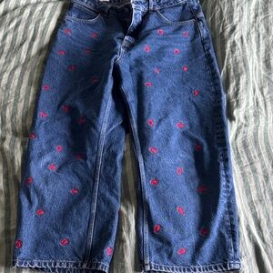 Free people jeans with crab embroidery.